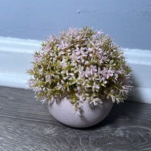 Pink fake plant in pot